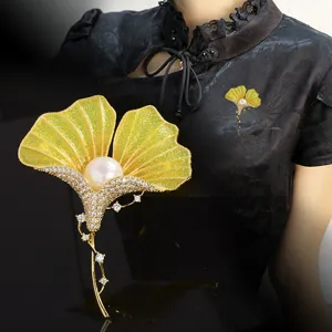 Elegant Chinese style ginkgo leaf enamel brooch detailed close-up with pearls and rhinestones