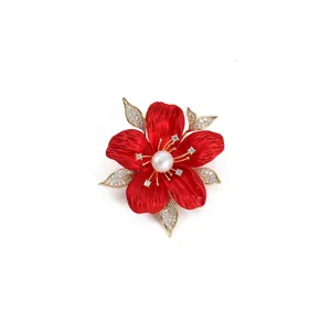 Red rhinestone flower brooch detail, elegant pearl center pin for women's apparel.