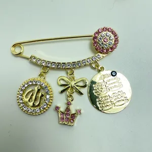 Exquisite gold rhinestone brooch pin with turkish evil eye and crown pendants for women.