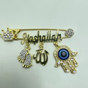 Exquisite gold-plated rhinestone Turkish evil eye brooch pin featuring Mashallah and Hamsa charms.