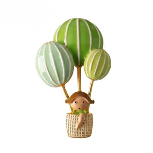 Cute enamel hot air balloon brooch with little girl design, perfect fashion accessory pin.