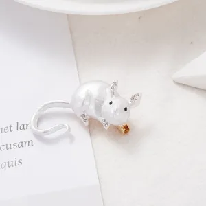 Close-up detail of a cute white mouse brooch, rhinestone and enamel accents for women.
