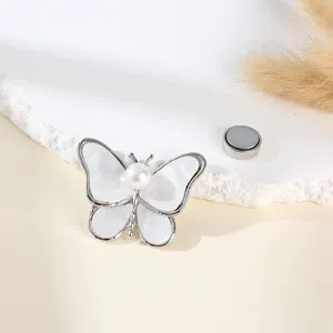 Elegant butterfly magnetic brooch with pearl inlay, secure hijab pin and clothing accessory.