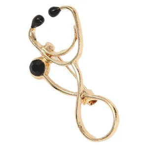Gold stethoscope brooch pin for medical staff, creative doctor badge apparel accessory.