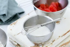 Stainless steel mini spring whisk for baking and cooking kitchen tool detail shot showing high quality.
