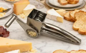 Stainless steel rotary cheese grater with hand crank kitchen tool for cheese grating.
