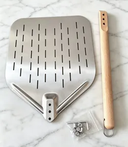 Perforated stainless steel pizza peel detail, detachable wooden handle and assembly hardware included.