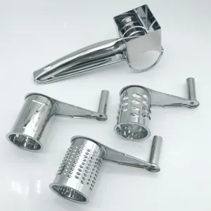Stainless steel rotary cheese grater detail showing interchangeable drums and main handle body.