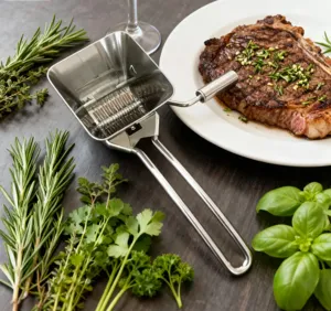 Stainless steel manual herb mill and vegetable mincer kitchen tool for fresh herbs detail view