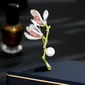 Magnolia flower brooch detail, elegant rhinestone crystal pearl enamel lapel pin accessory.