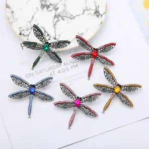 Cute crystal dragonfly brooch pin for women and girls, sparkling rhinestone insect fashion clothing accessory.