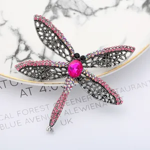 Exquisite dragonfly rhinestone brooch, detailed closeup showing pink crystal and alloy design.