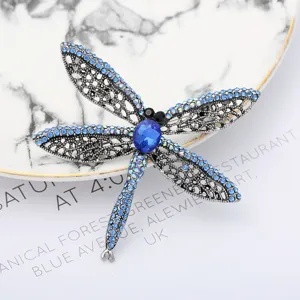 Exquisite blue rhinestone dragonfly brooch vintage silver tone fashion pin for women clothing.