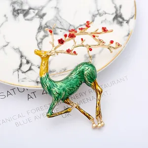 Elegant deer brooch with red plum blossoms, green enamel alloy pin for women's clothing.