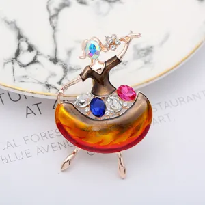 Exquisite dancing girl rhinestone brooch detail shot, elegant alloy fashion accessory.
