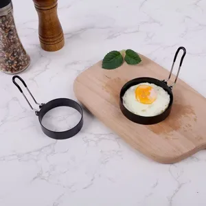 Stainless steel non-stick fried egg ring kitchen gadget, close-up detail shot for cooking.