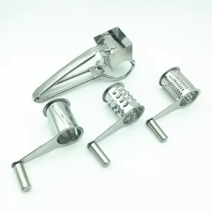 Stainless steel rotary cheese grater detail showing interchangeable drums and hand crank handle.