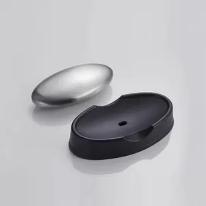 Stainless steel deodorizing soap with black holder, oval metal magic odor remover tool.