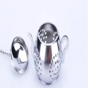 Closeup detail of stainless steel teapot shaped tea infuser with mesh holes lid and chain.