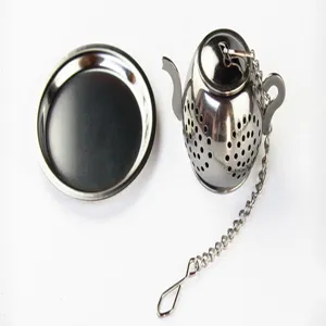 Stainless steel teapot tea infuser close-up detail, showing precise mesh holes and secure chain.
