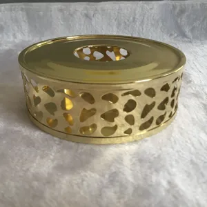 Gold stainless steel tea warmer detail shot showing the elegant hollow design and glossy finish.