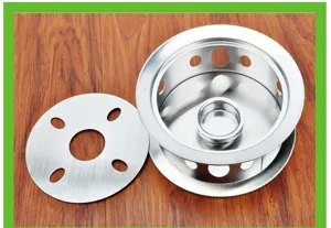 Stainless steel tea warmer detail view with circular candle base and cover plate.