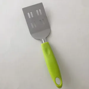 Stainless steel spatula with green handle, slotted turner for steak, eggs, and pizza.