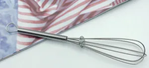 Stainless steel mini spring manual egg whisk detail for beating eggs and cream easily.