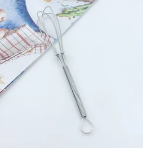 Stainless steel mini spring handle manual egg whisk for whipping eggs and creams easily.