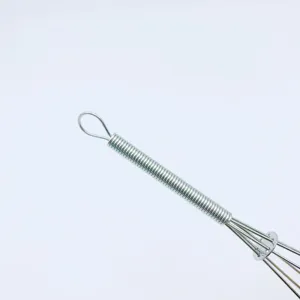 Close-up detail of stainless steel mini spring handle manual egg whisk handle view.