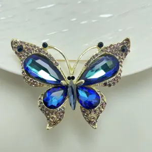 Close-up view of the exquisite butterfly brooch featuring sparkling blue and purple rhinestones.