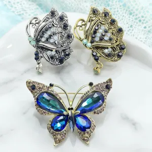 Detailed view of vintage rhinestone butterfly brooch set, exquisite crystal fashion accessories.