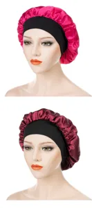 Detailed view of the satin sleep cap featuring a wide elastic black band and glossy fabric.
