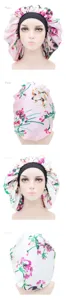 Detailed view of floral print satin sleeping cap with elastic band, soft hair care bonnet.