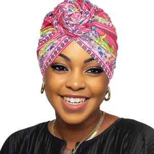 Chic printed turban hat for women, fashionable African style donut headwrap with floral pattern.