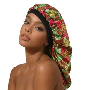 Long satin sleep cap with vintage print and black wide band for hair protection and styling.