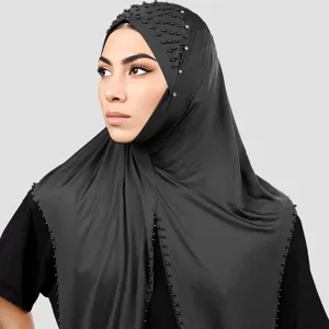 Close-up of black hijab headscarf featuring delicate pearl beads and sparkling rhinestone details.