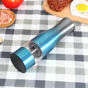 Electric pepper grinder with ceramic core and transparent container for kitchen use.