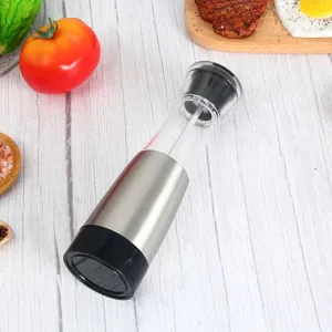 Detail view of the electric pepper grinder in a kitchen setting with clear view.