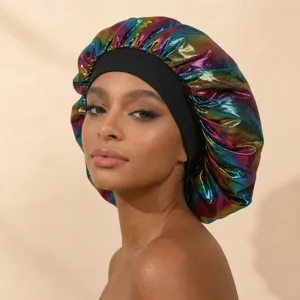 Close-up detail showing the metallic rainbow satin texture and black elastic band of the sleep cap.
