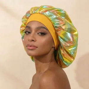 Close-up detail view of holographic satin sleeping cap with wide yellow band, hair care item.