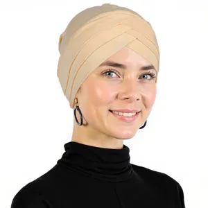 Close-up details of the light beige cross turban headscarf, soft milk silk fabric.