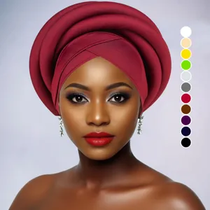 Close-up detail showing the exquisite pleated texture and rich color of the turban.