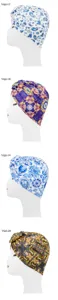 Ethnic style turban hat detail showing multiple colorful paisley prints and donut knot design.