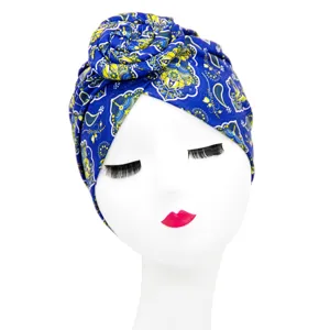 Ethnic style blue patterned donut turban hat for women, fashionable headwrap for daily wear.