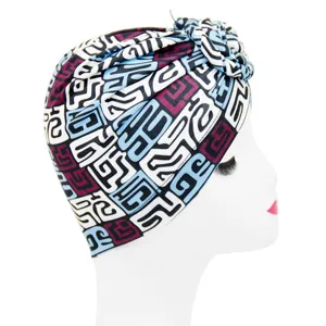 Ethnic geometric print turban hat for women, stylish knotted headwrap for daily wear.