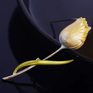 Closeup shot of exquisite tulip brooch detail, metal flower design with rich texture and shine.
