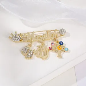 Gold alloy evil eye brooch detail with Masallah text and rhinestones for unique retro style.
