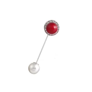Exquisite retro alloy long brooch featuring a stunning red stone and elegant pearl detail.