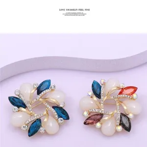 Exquisite floral rhinestone brooch detail shot, sparkling crystals and elegant pearl accents.